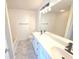Bathroom featuring double sink vanity with marble floors, sleek black hardware, and integrated tub at 1960 Dakota Nw Dr, Acworth, GA 30101
