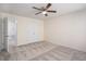 Neutral bedroom featuring light-colored carpet and a ceiling fan, with an open door into the en-suite bathroom at 1960 Dakota Nw Dr, Acworth, GA 30101