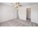 Bedroom featuring access to a walk in closet, neutral walls, and ceiling fan at 1960 Dakota Nw Dr, Acworth, GA 30101