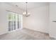 Bright dining area with sliding glass doors to a deck, and chandelier lighting at 1960 Dakota Nw Dr, Acworth, GA 30101