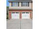 Home featuring a two-car garage with brick accents and complementary siding at 1960 Dakota Nw Dr, Acworth, GA 30101