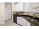 Well-appointed kitchen with granite counters, tile backsplash, and stainless steel dishwasher at 1960 Dakota Nw Dr, Acworth, GA 30101