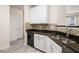 Kitchen featuring stainless steel sink, granite counters and white cabinetry at 1960 Dakota Nw Dr, Acworth, GA 30101