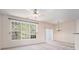 Bright living room with large windows and a modern ceiling fan provides a comfortable, airy space at 1960 Dakota Nw Dr, Acworth, GA 30101