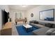 Bright living room featuring a sofa, accent tables, wall decor and access to the backyard at 1960 Dakota Nw Dr, Acworth, GA 30101