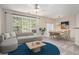 Bright living room with large windows, neutral tones, stylish furniture, and elegant dining area at 1960 Dakota Nw Dr, Acworth, GA 30101