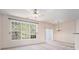 Bright living area with large windows, modern ceiling fan, and chandelier at 1960 Dakota Nw Dr, Acworth, GA 30101