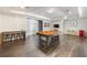 Basement features a pool table, wet bar and modern laminate flooring at 5138 Price Dr, Suwanee, GA 30024