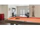 Basement with a pool table, wall mounted television and retro style refrigerator at 5138 Price Dr, Suwanee, GA 30024
