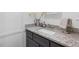 Bathroom vanity with gray cabinets and granite countertop at 5138 Price Dr, Suwanee, GA 30024