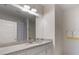 Bathroom features white cabinets, granite countertop, and a mirror at 5138 Price Dr, Suwanee, GA 30024
