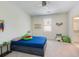 bedroom features a bed with storage drawers and a window at 5138 Price Dr, Suwanee, GA 30024