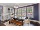 Dining area with modern lighting and a view of the well-maintained backyard at 5138 Price Dr, Suwanee, GA 30024
