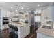 Modern kitchen featuring white cabinets, stainless steel appliances, and granite countertops at 5138 Price Dr, Suwanee, GA 30024