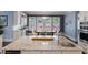 Spacious kitchen island with granite countertops and a stainless steel sink and faucet at 5138 Price Dr, Suwanee, GA 30024