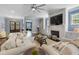 Spacious living room with cozy sofas, a fireplace, and elegant decor at 5138 Price Dr, Suwanee, GA 30024