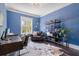 Bright home office with a leather chair, desk, and ample natural light from the window at 5138 Price Dr, Suwanee, GA 30024