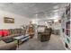 Finished basement with a decorative ceiling, ample seating, bookshelves, and a kitchenette at 1020 Burton Ne Dr, Atlanta, GA 30329
