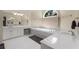 Bathroom featuring double sinks, a soaking tub, and a window with natural light at 1020 Burton Ne Dr, Atlanta, GA 30329