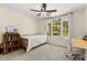 Well-lit bedroom featuring a single bed, study desk, and view of the outside at 1020 Burton Ne Dr, Atlanta, GA 30329