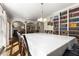 Spacious dining room with hardwood floors, and a large bookshelf filled with books at 1020 Burton Ne Dr, Atlanta, GA 30329