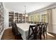 Large dining room featuring custom built-in bookcases and large windows for ample lighting at 1020 Burton Ne Dr, Atlanta, GA 30329