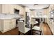 Well-appointed kitchen with white cabinetry, granite countertops, and stainless steel appliances at 1020 Burton Ne Dr, Atlanta, GA 30329