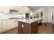 Elegant kitchen with stone countertops, a kitchen island, and seamless access to the dining room at 1020 Burton Ne Dr, Atlanta, GA 30329