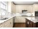 Gourmet kitchen with stone countertops, a kitchen island, and modern stainless steel appliances at 1020 Burton Ne Dr, Atlanta, GA 30329