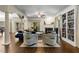 Spacious living room with a fireplace, custom bookshelves, and lots of natural light at 1020 Burton Ne Dr, Atlanta, GA 30329