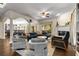 Open-concept living room with fireplace, stylish furnishings, and seamless flow to dining area at 1020 Burton Ne Dr, Atlanta, GA 30329