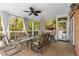 Inviting screened-in porch with comfortable seating and views of the surrounding trees at 1020 Burton Ne Dr, Atlanta, GA 30329