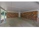 View of the brick home's carport featuring a concrete floor at 1093 Lanier Sw Dr, Marietta, GA 30060
