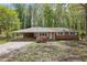 Charming single-story brick home with a carport and well-maintained landscaping at 1093 Lanier Sw Dr, Marietta, GA 30060