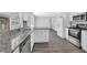 Spacious kitchen boasts granite countertops, stainless steel appliances, and ample cabinet space at 1093 Lanier Sw Dr, Marietta, GA 30060