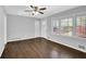 Living room with gleaming hardwood floors, abundant natural light, and a welcoming atmosphere at 1093 Lanier Sw Dr, Marietta, GA 30060