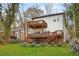 Large backyard with a multi-level deck, patio, and lush landscaping, perfect for outdoor entertaining at 2166 Belvedere Sw Ave, Atlanta, GA 30311