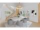 Elegant dining area with staircase, modern chandelier, and natural light at 2166 Belvedere Sw Ave, Atlanta, GA 30311