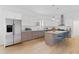 Modern kitchen with stainless steel appliances, granite countertops, and a stylish island with seating at 2166 Belvedere Sw Ave, Atlanta, GA 30311