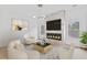 Inviting living room features a modern fireplace, a geometric rug, and ample natural light at 2166 Belvedere Sw Ave, Atlanta, GA 30311