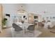 Open-concept living and dining area with modern lighting, stylish seating, and hardwood floors at 2166 Belvedere Sw Ave, Atlanta, GA 30311