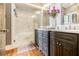 Bathroom featuring double vanities, marble countertops and walk-in shower at 978 North Ne Ave # 207, Atlanta, GA 30306