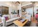 Open-concept living room with hardwood floors and adjacent modern kitchen at 978 North Ne Ave # 207, Atlanta, GA 30306
