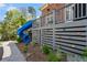Backyard deck featuring a slide and rock-climbing wall for , surrounded by landscaping at 1116 Dan Johnson Ne Rd, Atlanta, GA 30307