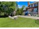Beautiful backyard features artificial turf, an outdoor fireplace, and mature trees at 1116 Dan Johnson Ne Rd, Atlanta, GA 30307