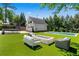 Spacious backyard with a pool, trampoline, fire pit, patio, and a garage at 1116 Dan Johnson Ne Rd, Atlanta, GA 30307