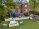 The home's backyard features artificial turf, a trampoline, a deck with a slide, and a fireplace at 1116 Dan Johnson Ne Rd, Atlanta, GA 30307