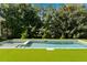 Large backyard featuring a modern pool, lush grass, and manicured greenery at 1116 Dan Johnson Ne Rd, Atlanta, GA 30307