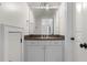 Bathroom featuring a vanity with a dark countertop and silver hardware, as well as a large mirror at 1116 Dan Johnson Ne Rd, Atlanta, GA 30307