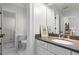 Bright bathroom features white cabinets, grey countertop, and decorative artwork at 1116 Dan Johnson Ne Rd, Atlanta, GA 30307